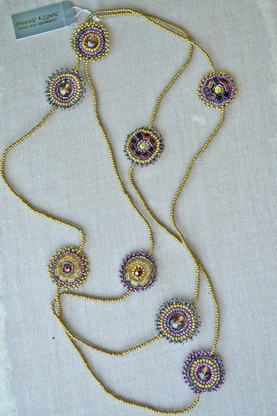 Beaded necklace with rounded accents