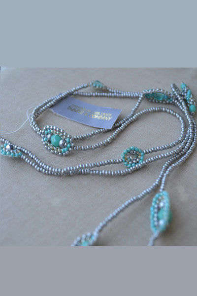 Beaded necklace with oval shape accents